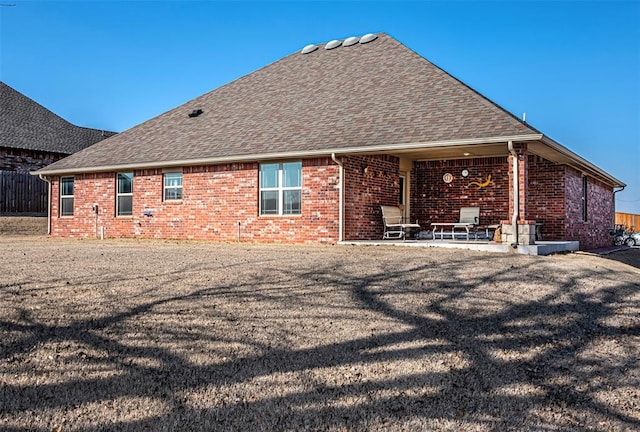 back of house with a patio