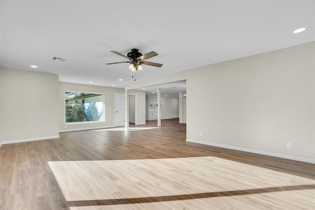 spare room with light hardwood / wood-style flooring and ceiling fan