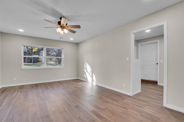 spare room featuring ceiling fan and light wood-type flooring