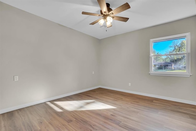 empty room with ceiling fan and light wood-type flooring