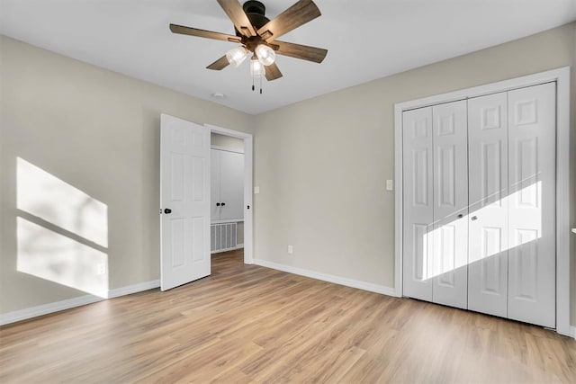 unfurnished bedroom with ceiling fan and light hardwood / wood-style floors