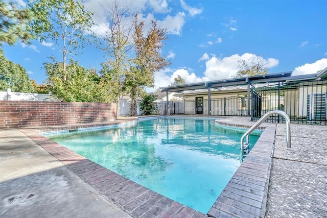 view of swimming pool with a patio