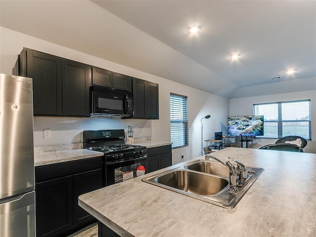 kitchen featuring sink, a center island, vaulted ceiling, and black appliances