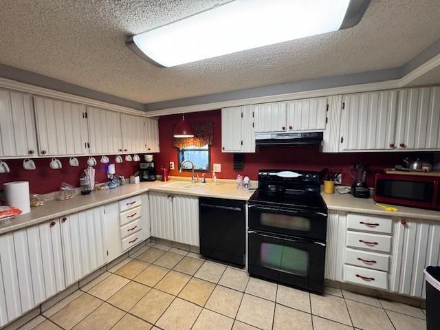 kitchen featuring white cabinets, light tile patterned floors, sink, and black appliances