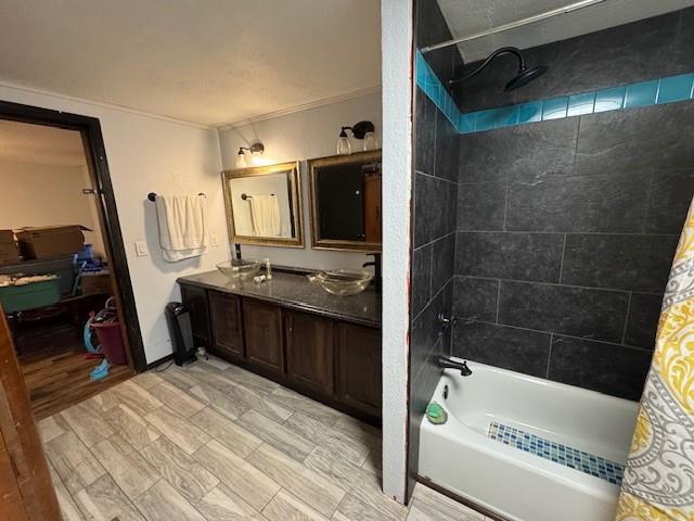 bathroom with ornamental molding, vanity, hardwood / wood-style flooring, and shower / bath combo with shower curtain