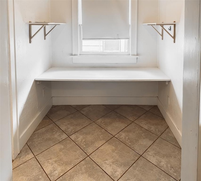 bathroom with tile patterned floors