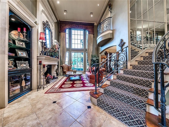 entrance foyer with crown molding and a high ceiling