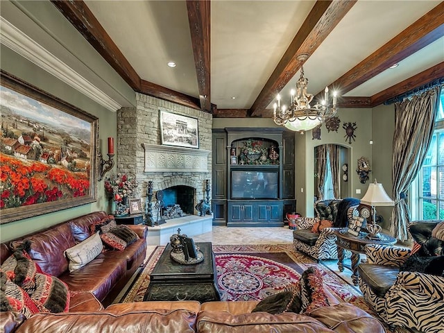 living room featuring beamed ceiling, a fireplace, and a notable chandelier