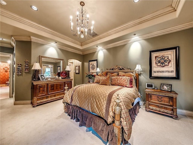 bedroom featuring a notable chandelier, carpet floors, ornamental molding, and a tray ceiling