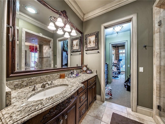 bathroom with vanity, tile patterned floors, plenty of natural light, and crown molding