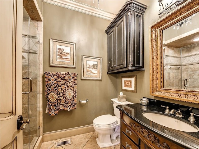 bathroom with vanity, a shower with door, crown molding, tile patterned flooring, and toilet