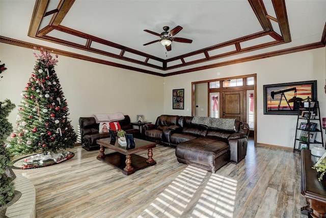 living room with hardwood / wood-style floors, ceiling fan, and crown molding