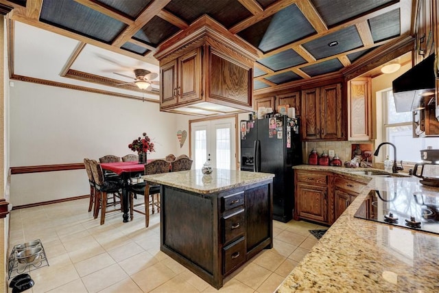 kitchen with black appliances, ceiling fan, sink, and coffered ceiling