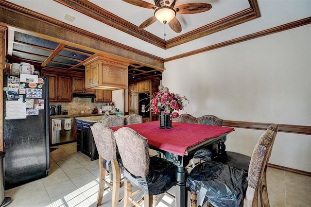 tiled dining area featuring ceiling fan and ornamental molding