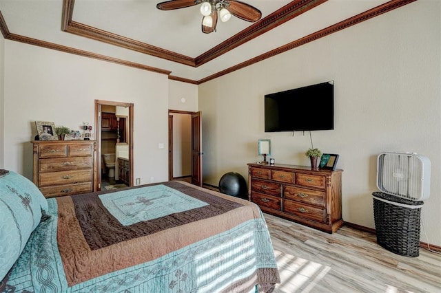 bedroom featuring connected bathroom, ceiling fan, light hardwood / wood-style flooring, and ornamental molding