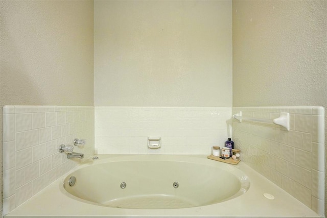 bathroom with a tub to relax in