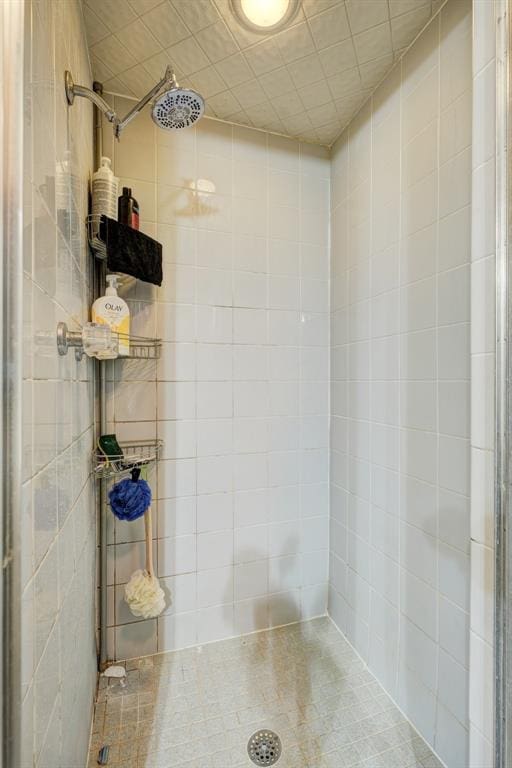 bathroom with a tile shower