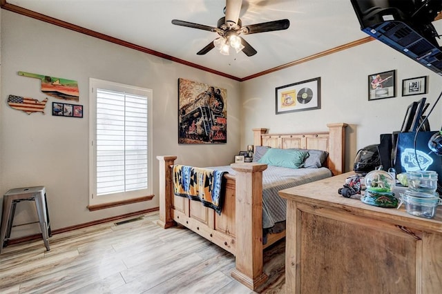 bedroom with ceiling fan, light hardwood / wood-style floors, and crown molding