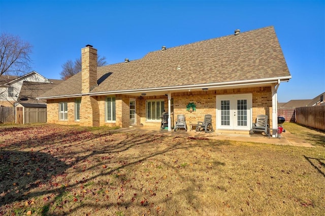 back of house featuring french doors, a yard, and a patio area