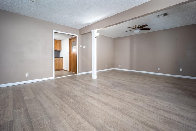 spare room with wood-type flooring, a textured ceiling, and ceiling fan