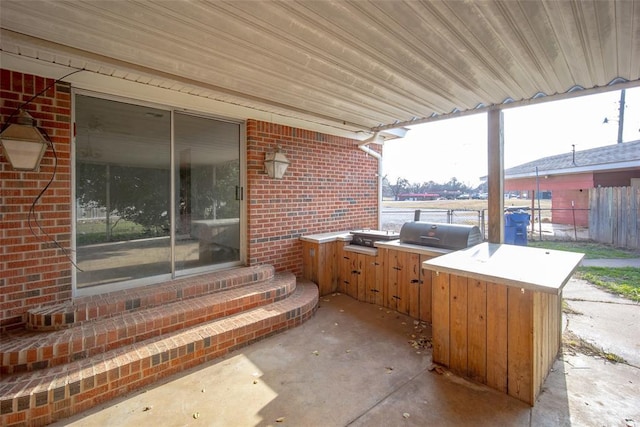 view of patio featuring a grill and exterior kitchen