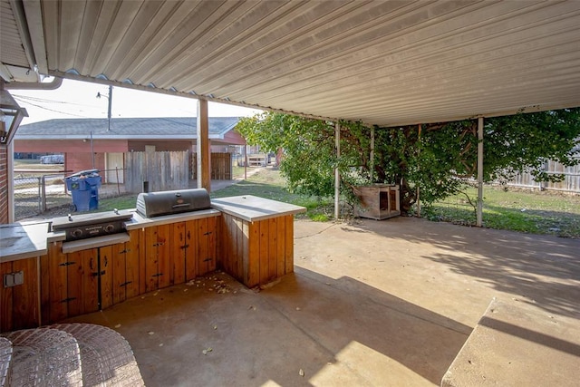 view of patio featuring area for grilling and exterior kitchen