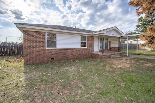 view of front of house with a front yard and covered porch