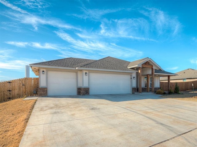 ranch-style house featuring a garage