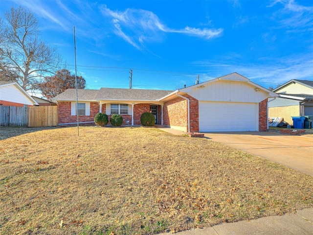 single story home featuring a front yard and a garage