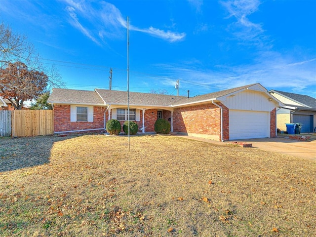 ranch-style house featuring a garage and a front yard