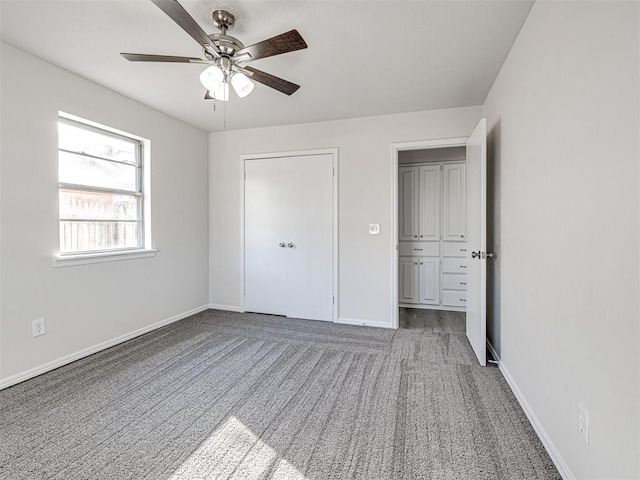 unfurnished bedroom with ceiling fan and carpet