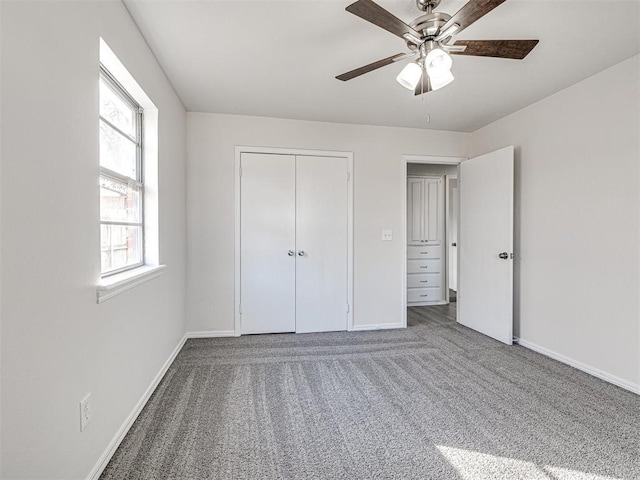 unfurnished bedroom with carpet flooring, ceiling fan, and a closet