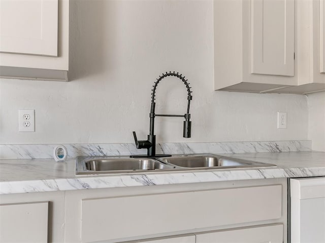 kitchen with white cabinets and sink