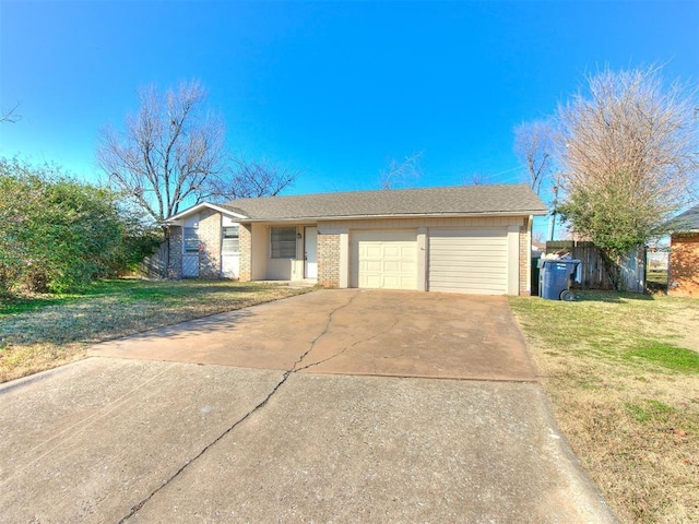 ranch-style home with a garage and a front yard