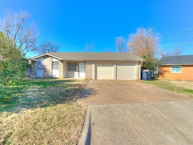 ranch-style house featuring a garage and a front lawn