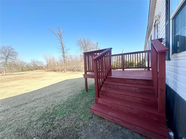 wooden deck with a yard