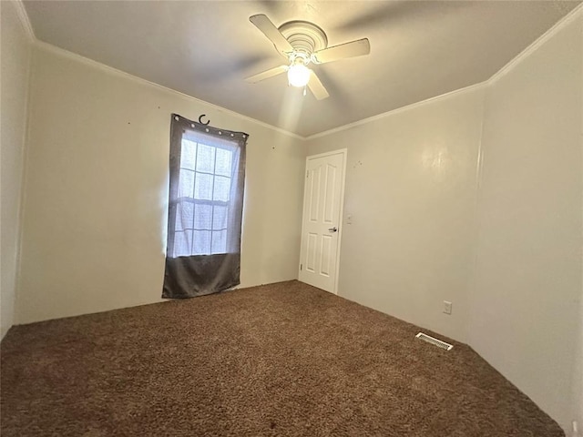 unfurnished room featuring carpet, ceiling fan, and ornamental molding