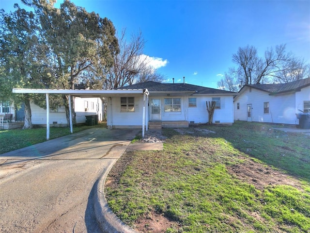 ranch-style house with a front lawn and a carport