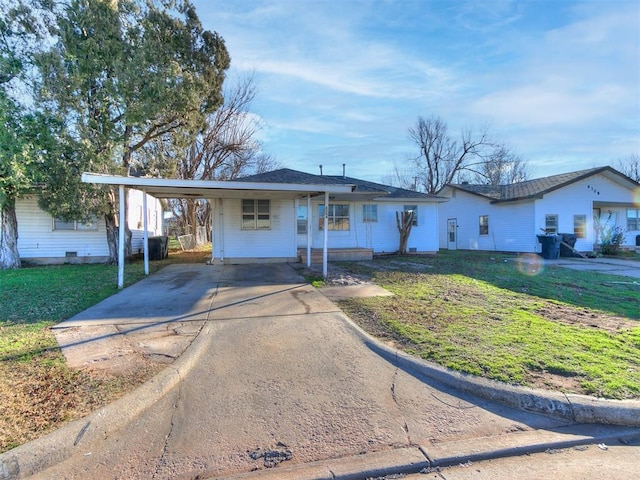 single story home with a front lawn and a carport