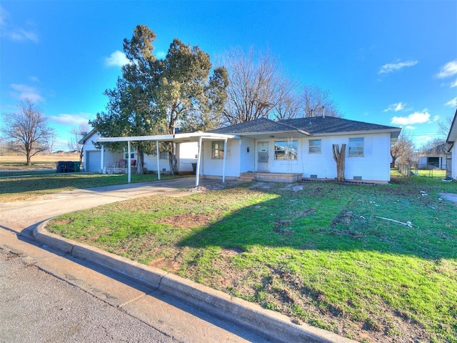 ranch-style house with a front yard and a carport