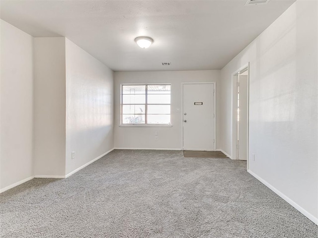 empty room featuring carpet flooring