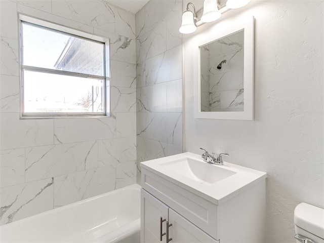 full bathroom with vanity, toilet, and tiled shower / bath combo