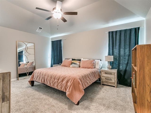 bedroom with carpet flooring, ceiling fan, and lofted ceiling