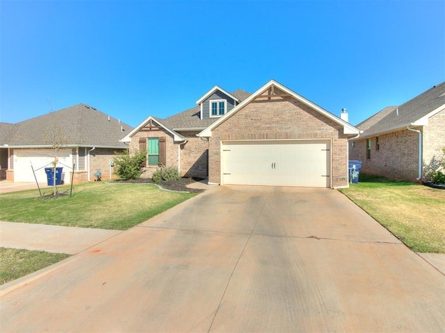 view of front facade with a front yard and a garage