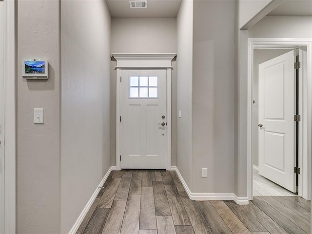 doorway to outside featuring light hardwood / wood-style floors