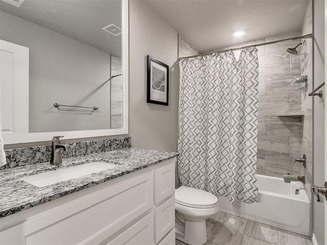 full bathroom featuring shower / bath combo with shower curtain, vanity, and toilet