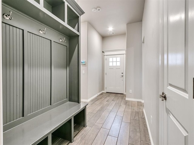 mudroom with light hardwood / wood-style flooring