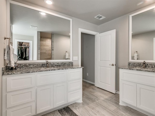 bathroom featuring vanity and wood-type flooring