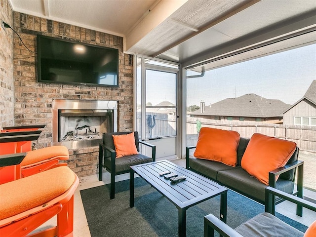 view of patio with an outdoor living space with a fireplace