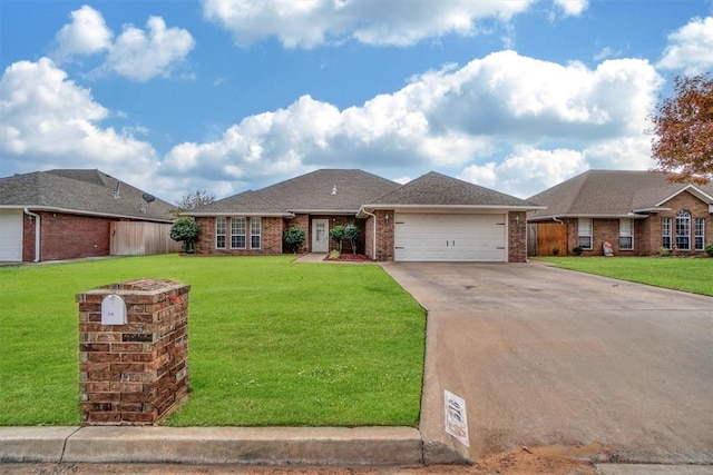 single story home with a garage and a front lawn